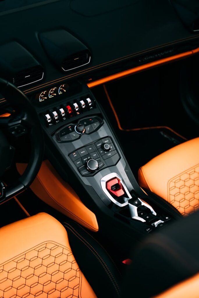 Close-up view of a luxury car's high-tech interior and control panel.